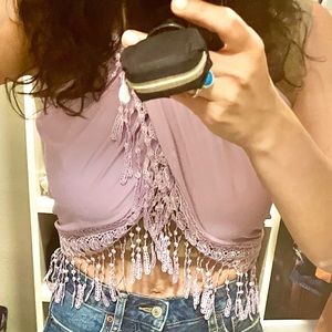 Cute purple fringe hemmed wrap top!